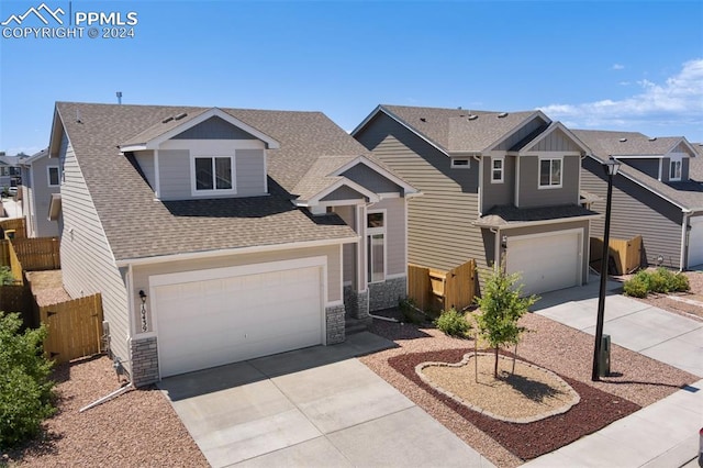 craftsman inspired home with a garage