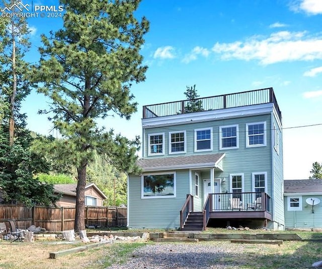 view of front of home featuring a wooden deck