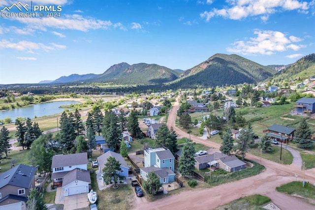 aerial view featuring a water and mountain view