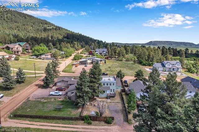 birds eye view of property with a mountain view