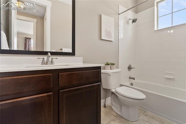 full bathroom with tile patterned flooring, shower / bath combo, toilet, and vanity