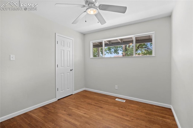 spare room featuring ceiling fan and wood-type flooring