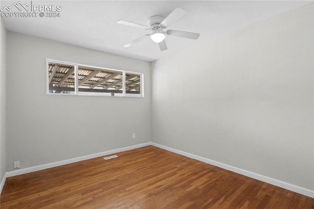 unfurnished room with hardwood / wood-style floors and ceiling fan