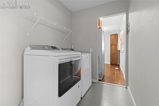 laundry area with separate washer and dryer