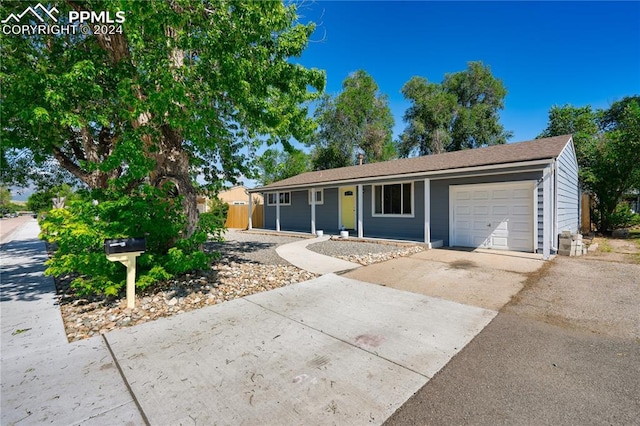 ranch-style home featuring a garage