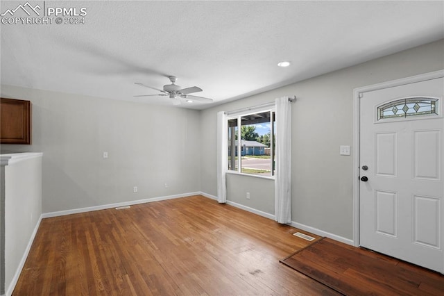 entryway with hardwood / wood-style flooring and ceiling fan