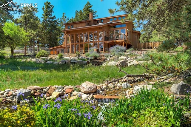 back of house featuring a wooden deck