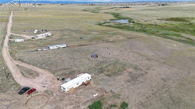 birds eye view of property featuring a rural view