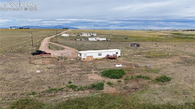 bird's eye view featuring a mountain view and a rural view