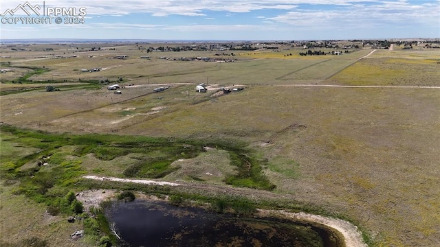 birds eye view of property featuring a rural view