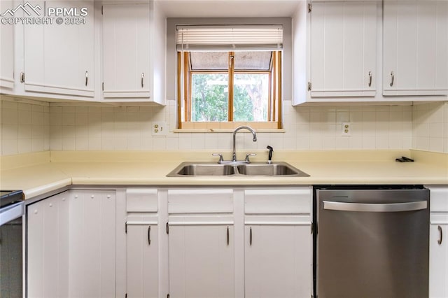 kitchen featuring sink, backsplash, white cabinetry, and dishwasher