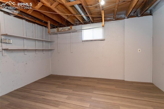 basement featuring light hardwood / wood-style floors