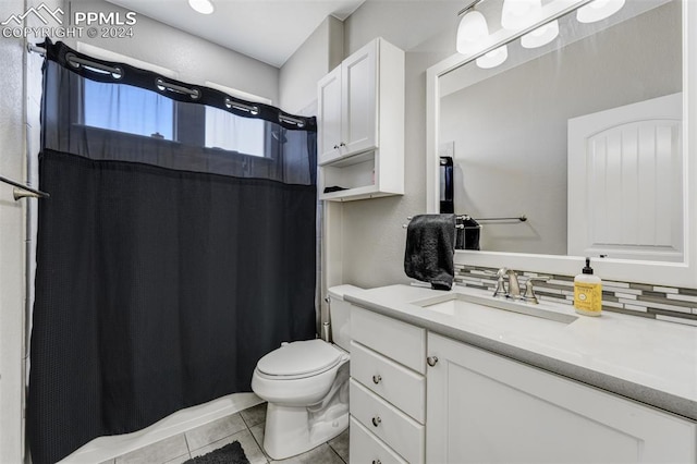 bathroom featuring backsplash, tile patterned floors, toilet, and vanity