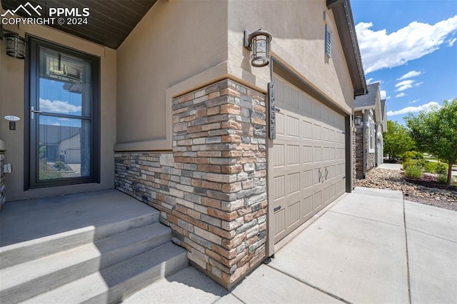 property entrance with a garage