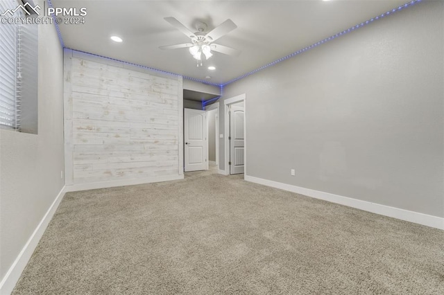 unfurnished room featuring carpet floors and ceiling fan