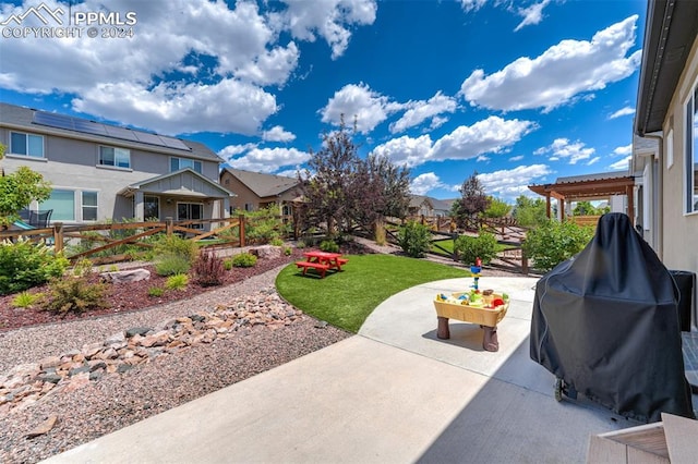 view of patio / terrace featuring a pergola and grilling area