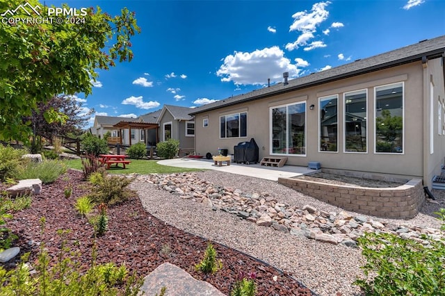 rear view of house with a patio area