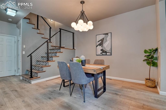 dining room featuring a chandelier and light wood-type flooring