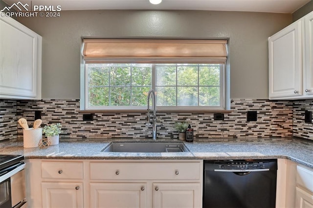 kitchen featuring dishwasher, sink, decorative backsplash, and white cabinets