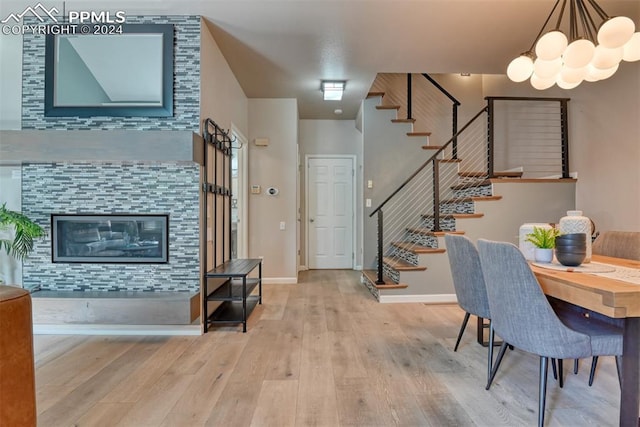 dining area with an inviting chandelier and wood-type flooring