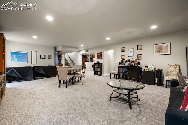 living room featuring light carpet