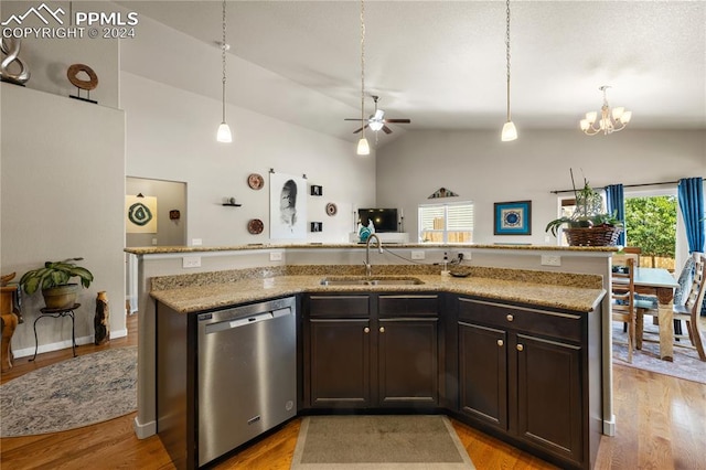 kitchen featuring light hardwood / wood-style floors, stainless steel dishwasher, ceiling fan with notable chandelier, and vaulted ceiling