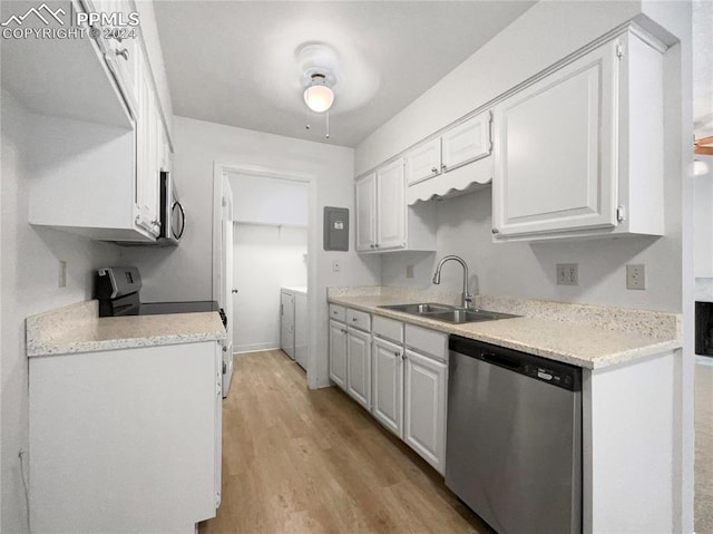 kitchen featuring stainless steel appliances, light hardwood / wood-style floors, sink, and white cabinets