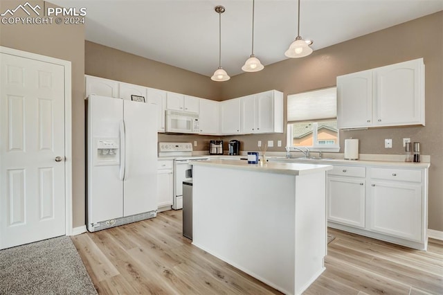 kitchen featuring white cabinetry, hanging light fixtures, white appliances, and a kitchen island