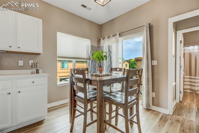 dining space featuring light hardwood / wood-style flooring