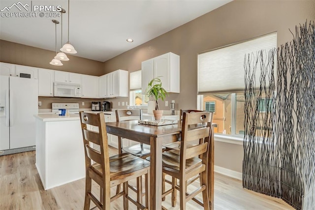 dining space featuring light hardwood / wood-style floors