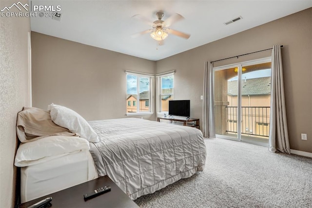 carpeted bedroom featuring multiple windows, access to outside, and ceiling fan