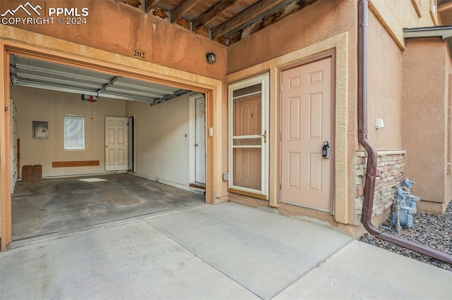 garage featuring a garage door opener and electric panel