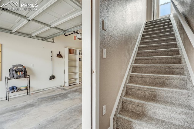 stairway with concrete floors