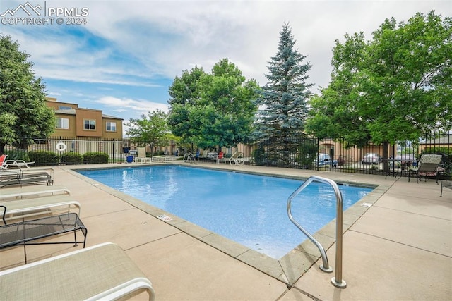 view of swimming pool featuring a patio