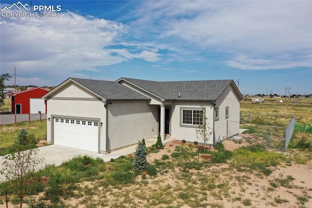 single story home featuring a garage