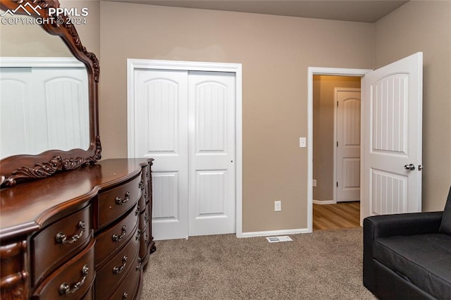 carpeted bedroom with a closet