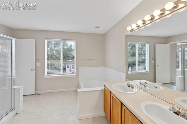 bathroom featuring independent shower and bath and vanity