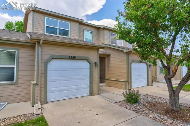 view of front of property featuring a garage