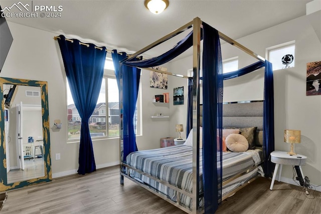 bedroom featuring wood-type flooring