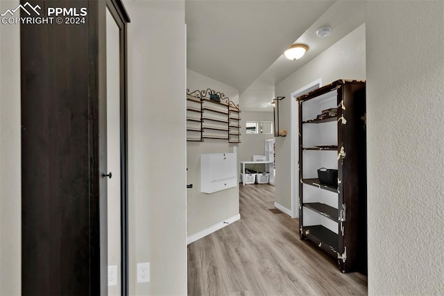 corridor featuring light hardwood / wood-style flooring