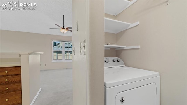 laundry area with washer / clothes dryer, light colored carpet, and ceiling fan