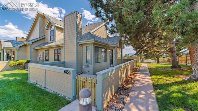 view of home's exterior with a yard