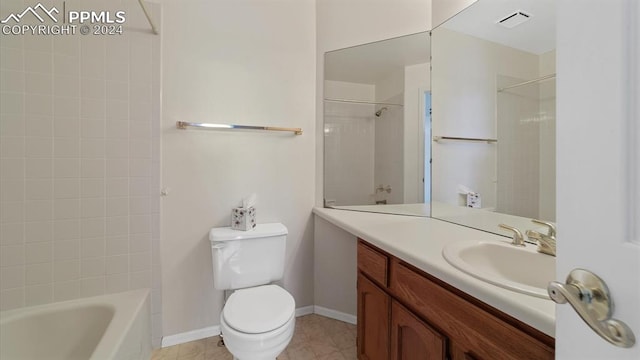 full bathroom featuring tiled shower / bath combo, tile patterned floors, toilet, and vanity