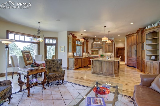 4950 Longwood Pt, Colorado Springs, CO 80906 - living room with recessed lighting, light wood-style flooring, and baseboards