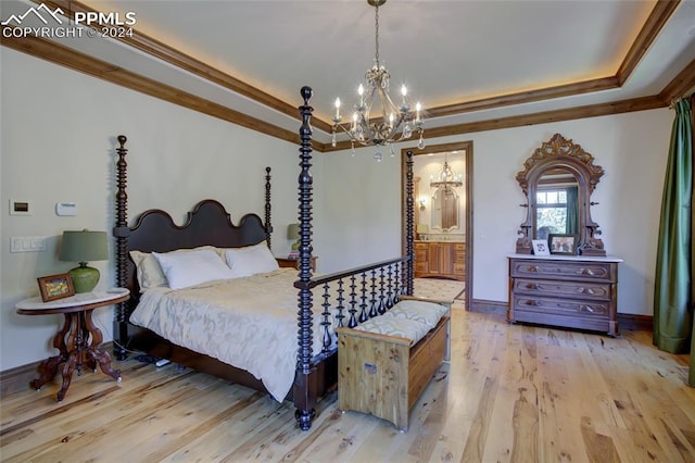 4950 Longwood Pt, Colorado Springs, CO 80906 - bedroom featuring wood finished floors, baseboards, ornamental molding, a tray ceiling, and an inviting chandelier