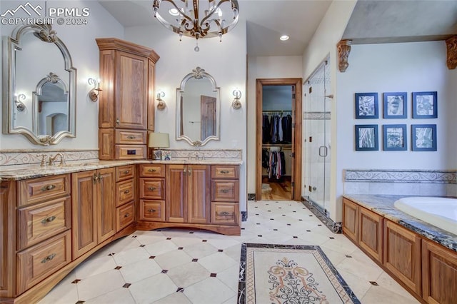 4950 Longwood Pt, Colorado Springs, CO 80906 - full bathroom featuring double vanity, a stall shower, a spacious closet, a chandelier, and a bath