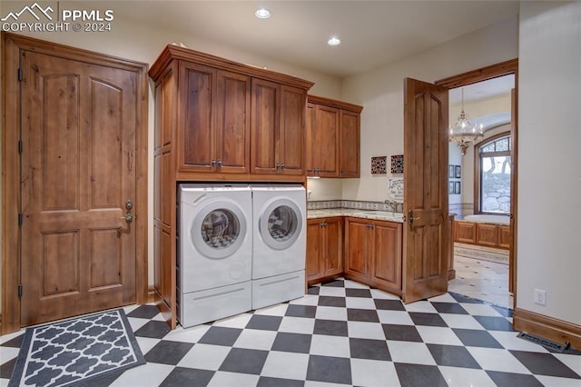 4950 Longwood Pt, Colorado Springs, CO 80906 - laundry area with cabinet space, dark floors, visible vents, and washer and dryer