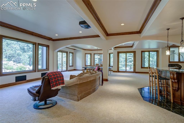4950 Longwood Pt, Colorado Springs, CO 80906 - living room with baseboards, arched walkways, ornamental molding, carpet floors, and recessed lighting
