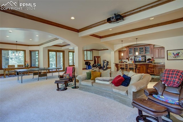 4950 Longwood Pt, Colorado Springs, CO 80906 - living room featuring a healthy amount of sunlight, carpet floors, arched walkways, and recessed lighting