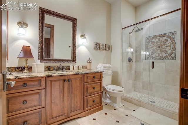 4950 Longwood Pt, Colorado Springs, CO 80906 - bathroom featuring toilet, a stall shower, tile patterned flooring, and vanity